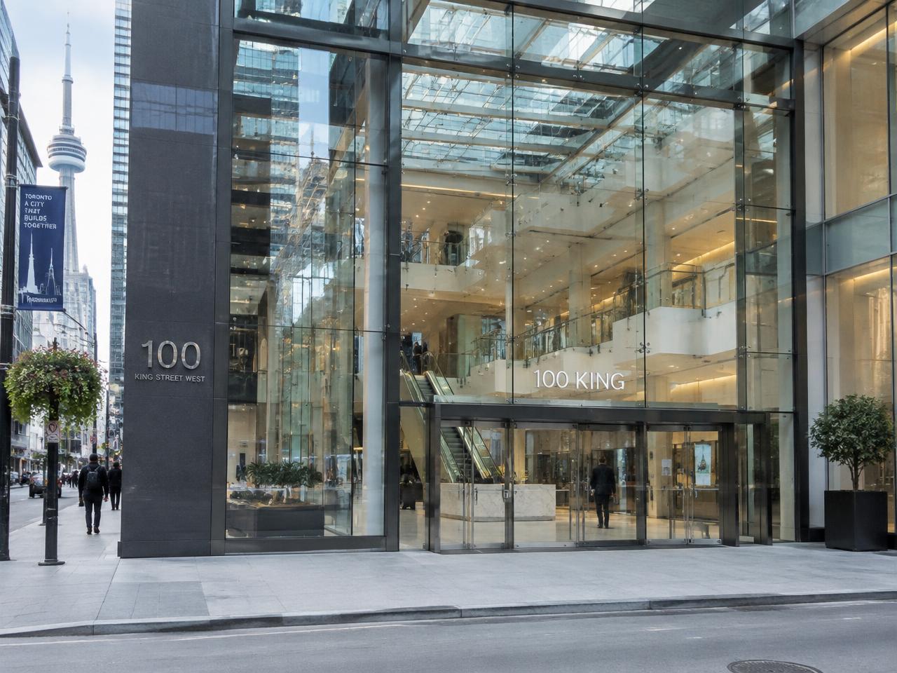 Glass storefront entrance of a downtown Toronto building